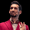 Il volto di Nicola in pixel art, sorridente, con il papillon e la giacca rossa.
